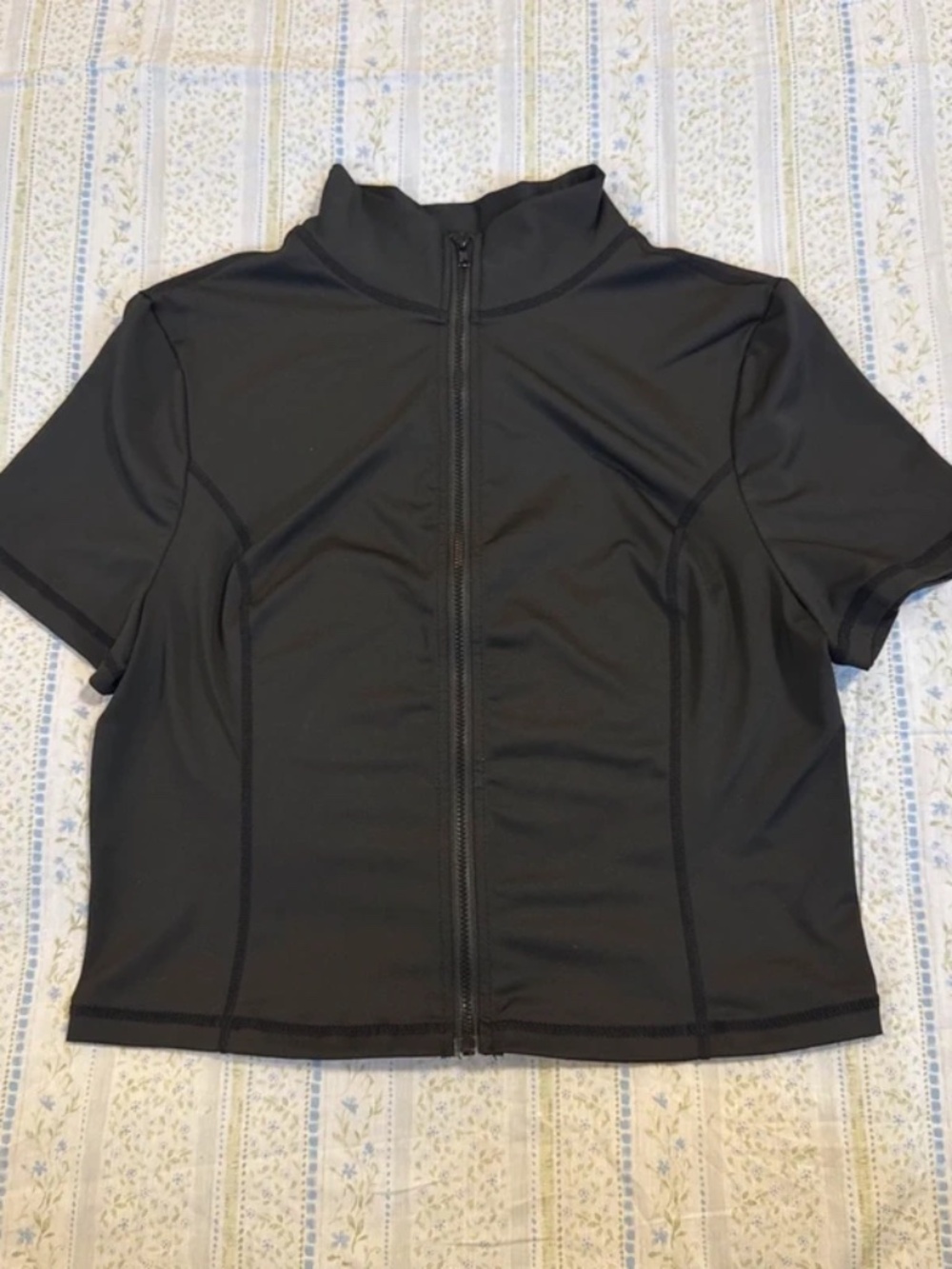 Black zip-up athletic crop top